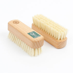 A Slice Of Green Wooden Nail Brush