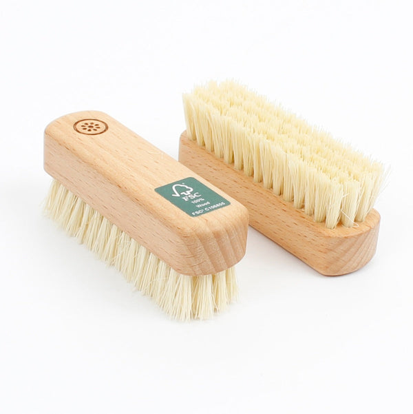 A Slice Of Green Wooden Nail Brush
