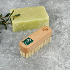 A Slice Of Green Wooden Nail Brush