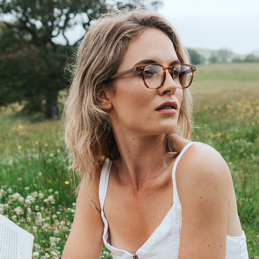 Girl wearing eco friendly red acetate glasses